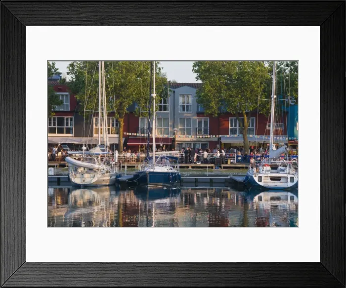 Framed Print : Open-air restaurants overlooking yachts moored in the ancient harbour at La Rochelle Framed Print : Open-air restaurants overlooking yachts moored in the ancient harbour at La Rochelle