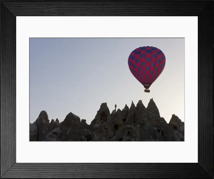 Framed Print : Hot air balloon taking off with tourists on board for a flight over the famous volcanic tufa rock formations around Goreme, Cappadocia, Anatolia, Turkey, Asia Framed Print : Hot air balloon taking off with tourists on board for a flight over the famous volcanic tufa rock formations around Goreme, Cappadocia, Anatolia, Turkey, Asia