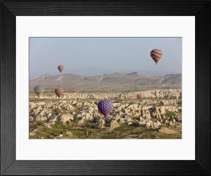 Framed Print : Hot air balloon flight over the famous volcanic tufa rock formations around Goreme Framed Print : Hot air balloon flight over the famous volcanic tufa rock formations around Goreme