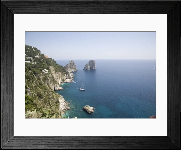 Framed Print : The coast line of the island of Capri, with the famous Faraglioni rocks on the back ground Framed Print : The coast line of the island of Capri, with the famous Faraglioni rocks on the back ground
