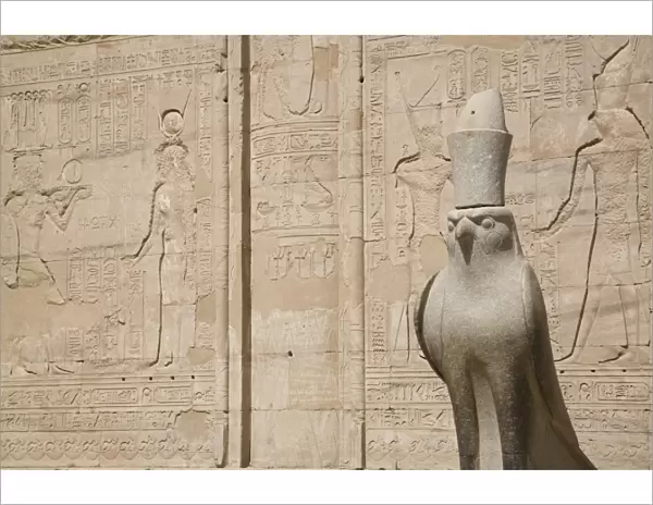 Statue of the falcon, sacred bird of Horus, at the entrance of the Temple of Edfu