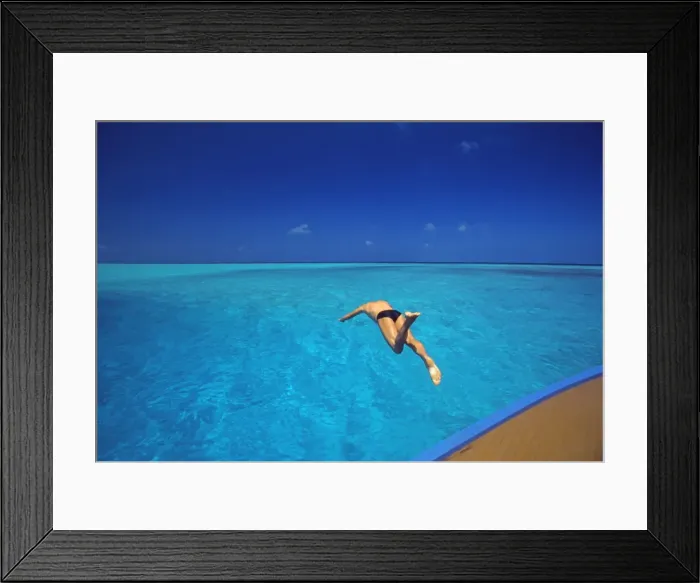 Framed Print : Man jumping into tropical sea from deck, Maldives, Indian Ocean, Asia Framed Print : Man jumping into tropical sea from deck, Maldives, Indian Ocean, Asia