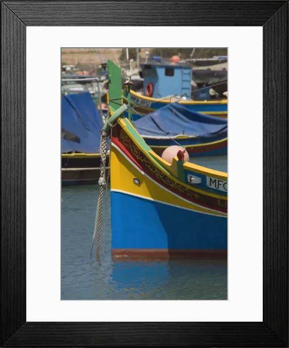 Framed Print : Brightly coloured fishing boats called Luzzus with the eye of Osiris to ward off evil at Marsaxlokk Framed Print : Brightly coloured fishing boats called Luzzus with the eye of Osiris to ward off evil at Marsaxlokk