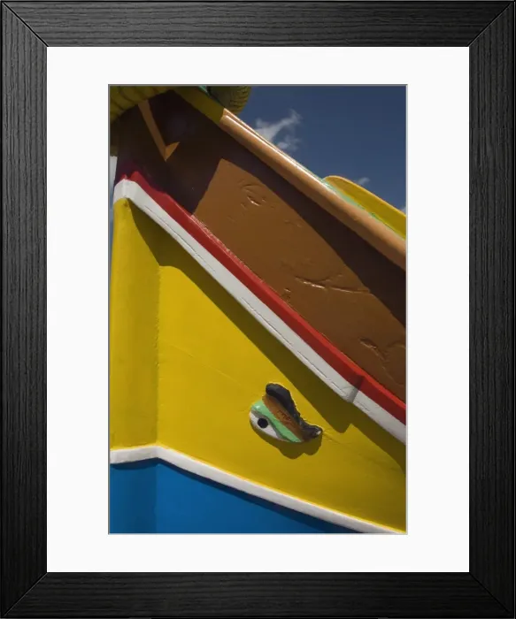 Framed Print : Close-up of a brightly coloured fishing boat (Luzzus) with the eye of Osiris to ward off evil at Marsaxlokk, a fishing village Framed Print : Close-up of a brightly coloured fishing boat (Luzzus) with the eye of Osiris to ward off evil at Marsaxlokk, a fishing village
