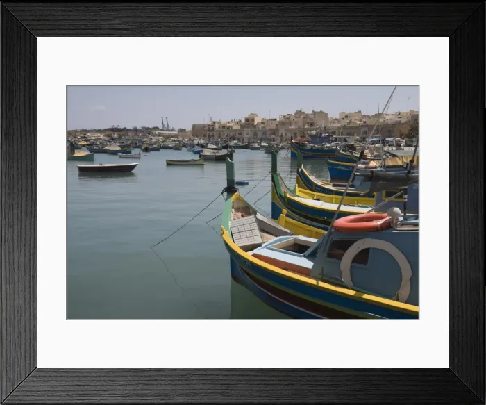 Framed Print : Brightly coloured fishing boats called Luzzus at the fishing village of Marsaxlokk Framed Print : Brightly coloured fishing boats called Luzzus at the fishing village of Marsaxlokk