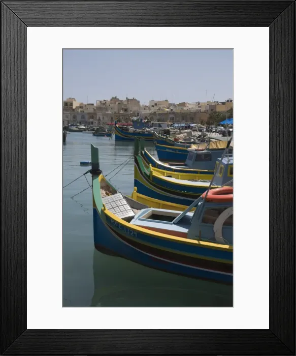 Framed Print : Brightly coloured fishing boats called Luzzus at the fishing village of Marsaxlokk