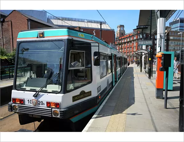 Metrolink tram at tram stop, Manchester, England, United Kingdom, Europe