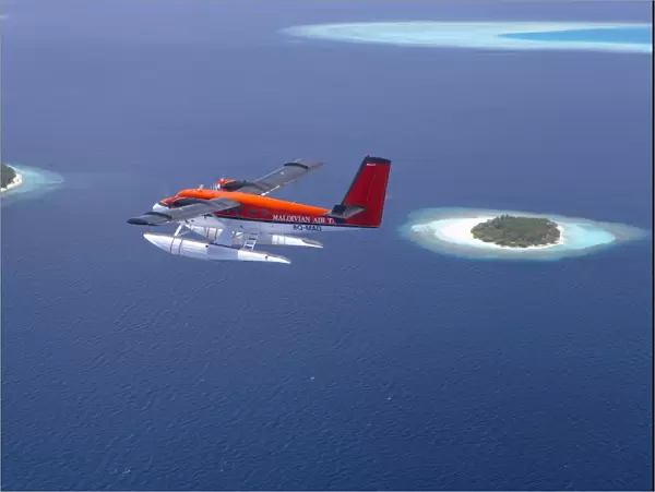 Aerial view of Maldivian air taxi flying above islands in the Maldives