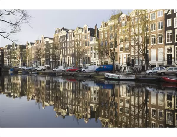 Houses reflecting in the Singel canal, Amsterdam, Netherlands, Europe