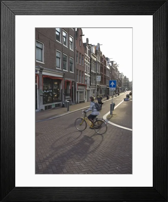 Framed Print : Early morning commuter on a bicycle, Amsterdam, Netherlands, Europe Framed Print : Early morning commuter on a bicycle, Amsterdam, Netherlands, Europe