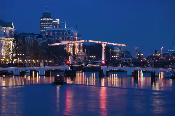 The Magere Bridge at night, also known as the Skinny Bridge, Amstel River
