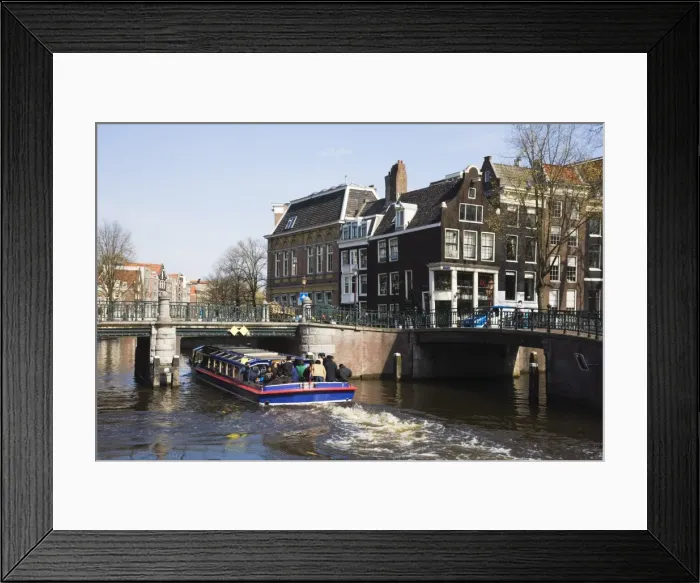 Framed Print : Tourist canal boat on the Leidsegracht canal, Amsterdam, Netherlands, Europe Framed Print : Tourist canal boat on the Leidsegracht canal, Amsterdam, Netherlands, Europe