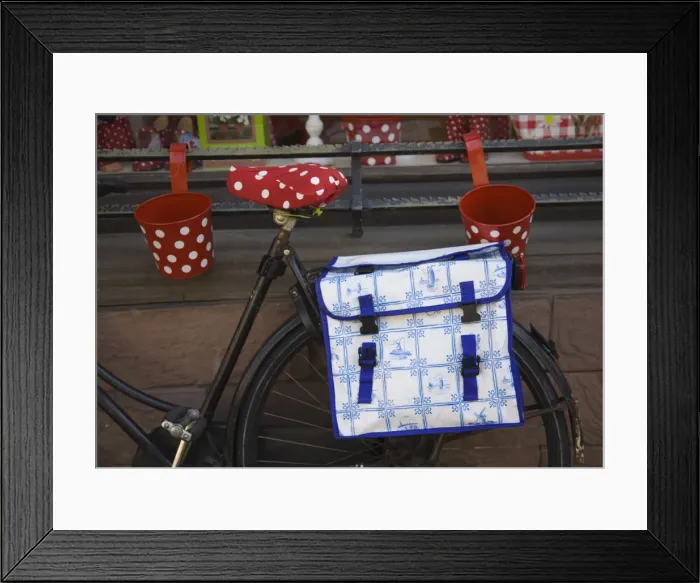 Framed Print : Old bicycle with a Delft design saddlebag. Amsterdam, Netherlands, Europe Framed Print : Old bicycle with a Delft design saddlebag. Amsterdam, Netherlands, Europe