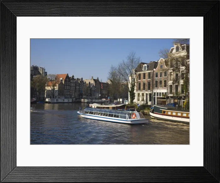 Framed Print : Tourist boat at the Golden Bend on the Herengracht canal, Amsterdam, Netherlands, Europe Framed Print : Tourist boat at the Golden Bend on the Herengracht canal, Amsterdam, Netherlands, Europe