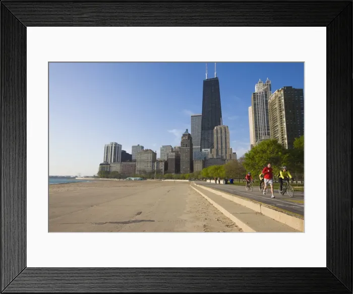 Framed Print : Joggers and cyclists on Lake Michigan shore with the Near North skyline behind Framed Print : Joggers and cyclists on Lake Michigan shore with the Near North skyline behind