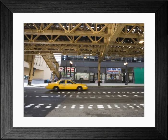 Framed Print : Taxi on a road under The El, elevated train system, The Loop, Chicago, Illinois Framed Print : Taxi on a road under The El, elevated train system, The Loop, Chicago, Illinois