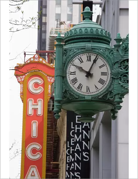 The Marshall Field Building Clock and Chicago Theatre behind, Chicago, Illinois