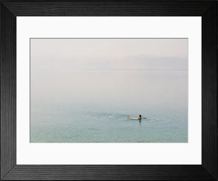 Framed Print : Man swimming in the Dead Sea, Jordan, Middle East Framed Print : Man swimming in the Dead Sea, Jordan, Middle East