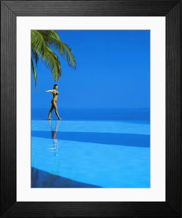 Framed Print : Woman balancing on edge of infinity pool, Maldives, Indian Ocean, Asia Framed Print : Woman balancing on edge of infinity pool, Maldives, Indian Ocean, Asia