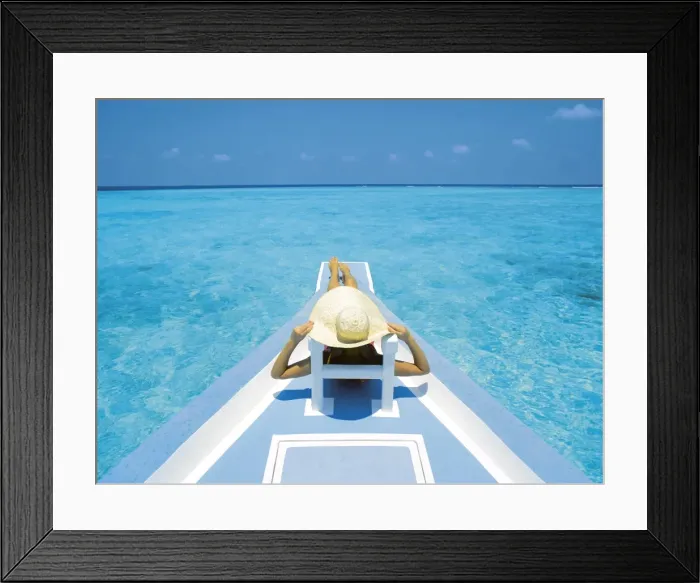 Framed Print : Woman relaxing on deck of boat, Maldives, Indian Ocean, Asia Framed Print : Woman relaxing on deck of boat, Maldives, Indian Ocean, Asia