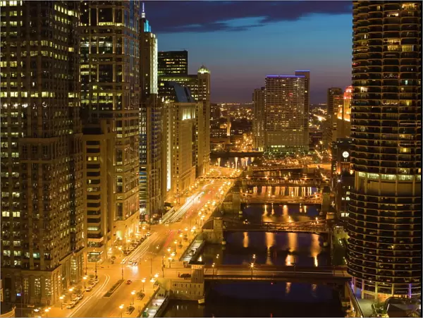 Buildings along Wacker Drive and the Chicago River at dusk, Chicago, Illinois