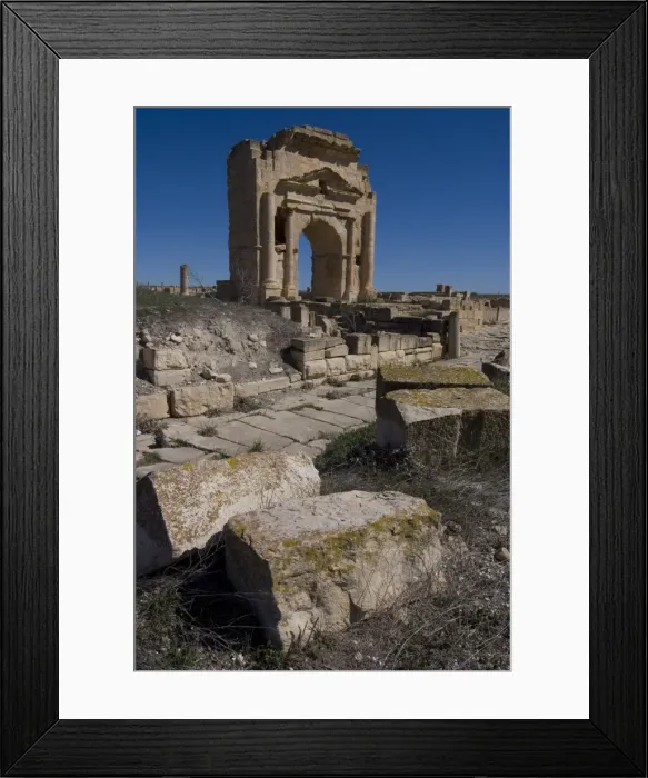 Framed Print : East-west road, with Arch of Trajan behind, Roman ruins of Makhtar, Tunisia Framed Print : East-west road, with Arch of Trajan behind, Roman ruins of Makhtar, Tunisia