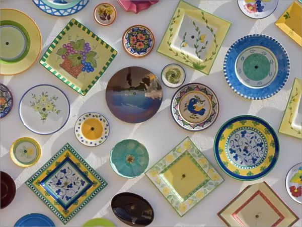 Traditional Portuguese pottery at artisan workshop with plates on wall, Cape St