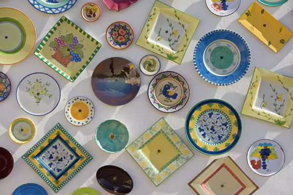 Traditional Portuguese pottery at artisan workshop with plates on wall, Cape St