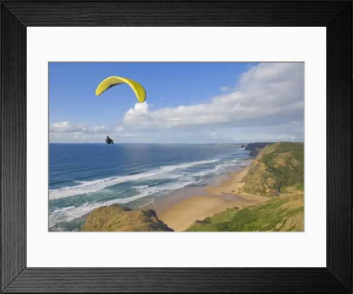 Framed Print : Paraglider with yellow wing above the south west coast of Portugal, Costa Vincentina Framed Print : Paraglider with yellow wing above the south west coast of Portugal, Costa Vincentina