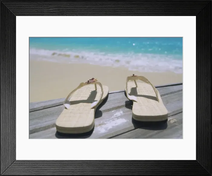 Framed Print : Pair of slippers on deck on beach Framed Print : Pair of slippers on deck on beach