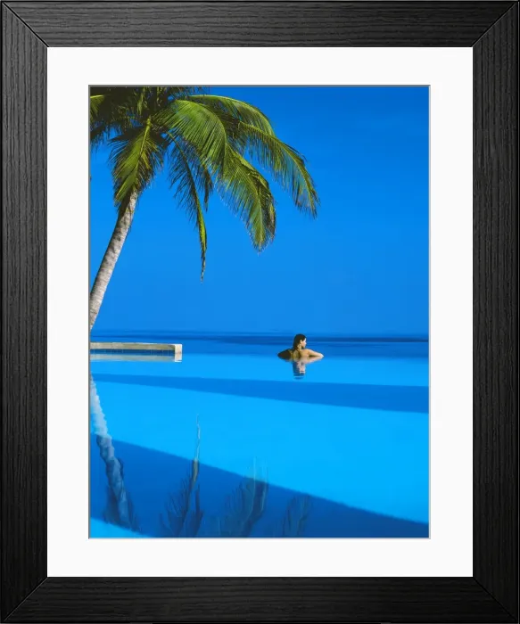 Framed Print : Woman in swimming pool under palm tree looking at sea, Maldives, Indian Ocean, Asia Framed Print : Woman in swimming pool under palm tree looking at sea, Maldives, Indian Ocean, Asia