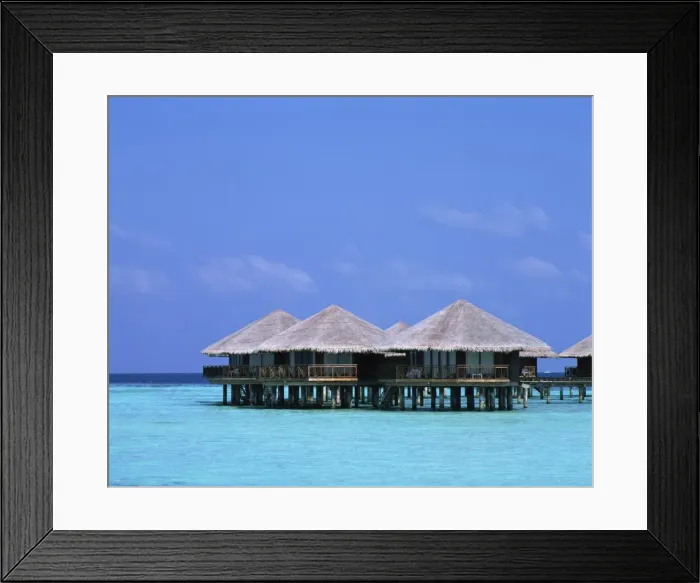 Framed Print : Thatched bungalows over the water in the Maldive Islands, Indian Ocean, Asia Framed Print : Thatched bungalows over the water in the Maldive Islands, Indian Ocean, Asia