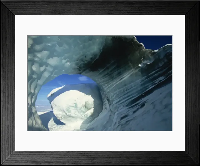 Framed Print : Glacial meltwater tunnel in iceberg showing sculpted water flow patterns Framed Print : Glacial meltwater tunnel in iceberg showing sculpted water flow patterns