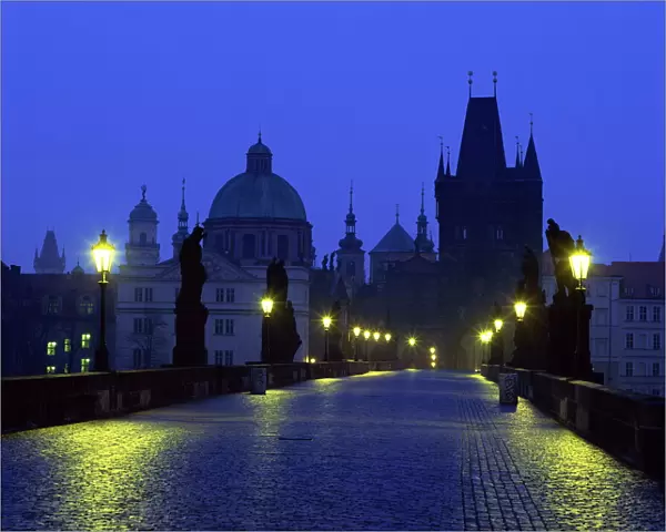 The Charles Bridge at night and city skyline with spires, UNESCO World Heritage Site
