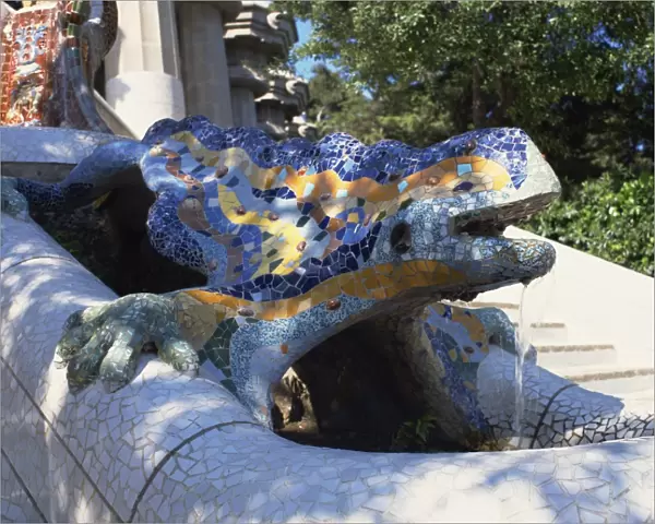 Close-up of a mosaic dragon statue in the Guell Park of Gaudi architecture