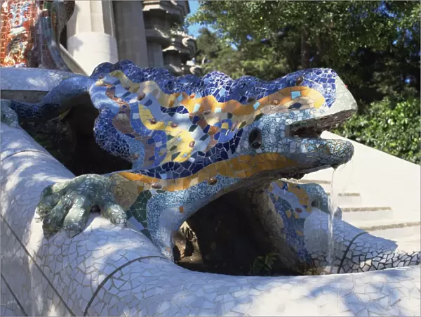 Close-up of a mosaic dragon statue in the Guell Park of Gaudi architecture