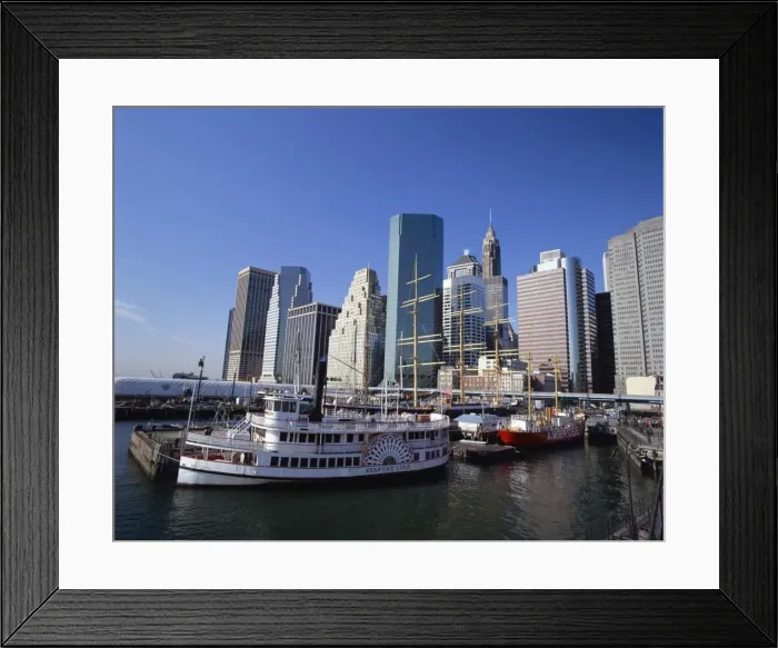 Framed Print : Boats in the harbour at South Street Sea Port, with the city skyline in the background Framed Print : Boats in the harbour at South Street Sea Port, with the city skyline in the background