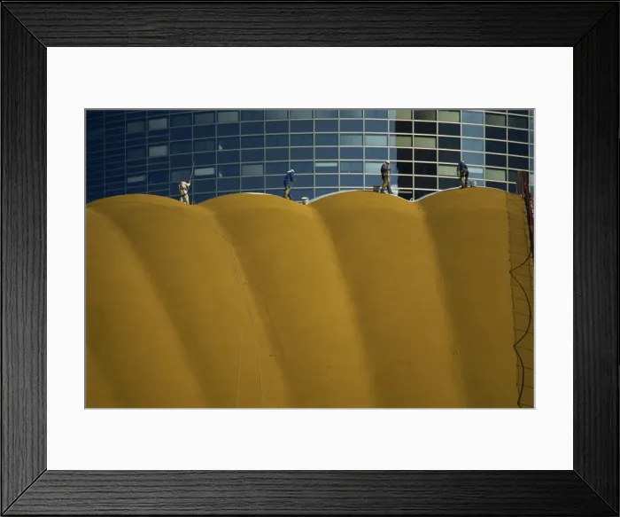 Framed Print : Figures cleaning the exterior of a modern office building, La Defense, Paris Framed Print : Figures cleaning the exterior of a modern office building, La Defense, Paris