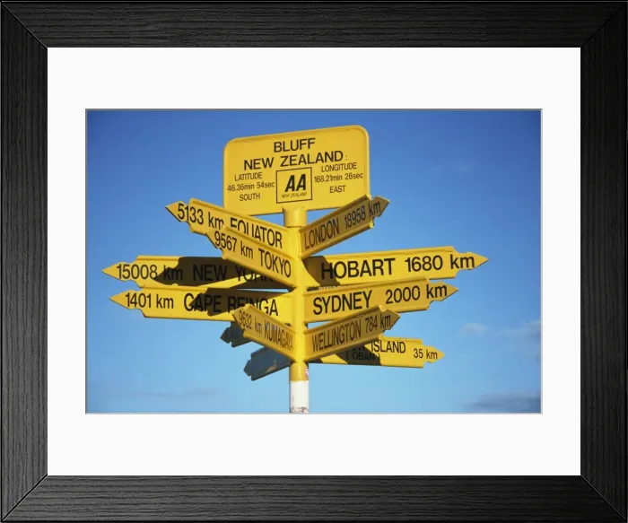 Framed Print : Signposts to cities around the world at most southerly point in the country Framed Print : Signposts to cities around the world at most southerly point in the country