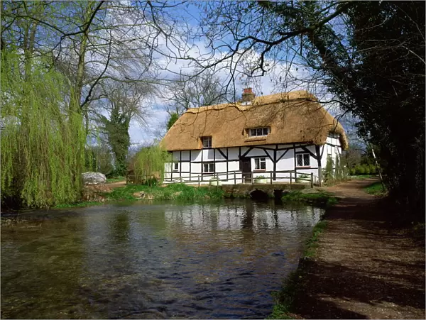 Riverside thatched cottage, New Alresford, Hampshire, England, United Kingdom, Europe