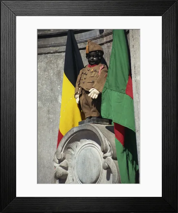 Framed Print : The Manneken Pis in uniform, Brussels, Belgium, Europe Framed Print : The Manneken Pis in uniform, Brussels, Belgium, Europe