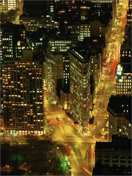 The Flat Iron Building and Broadway illuminated at night, viewed from the Empire State Building