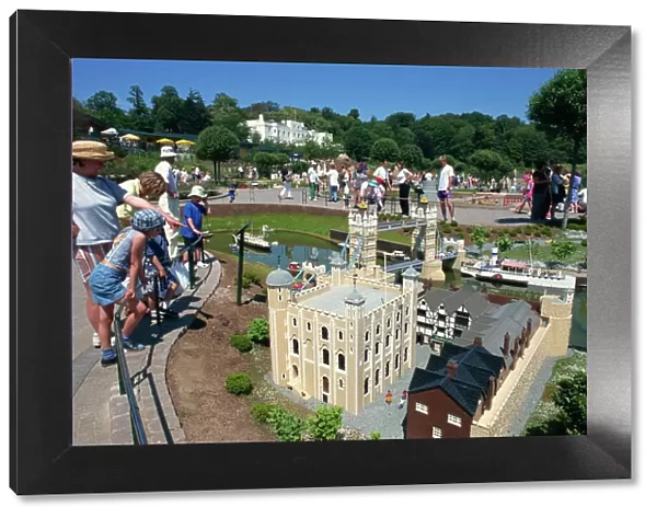 People admiring models of the Tower of London and Tower Bridge, Legoland amusement park