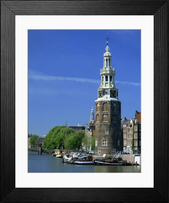 Framed Print : Boats on the canal beside a tower, the Montelbaanstoren, in Amsterdam, Holland, Europe Framed Print : Boats on the canal beside a tower, the Montelbaanstoren, in Amsterdam, Holland, Europe