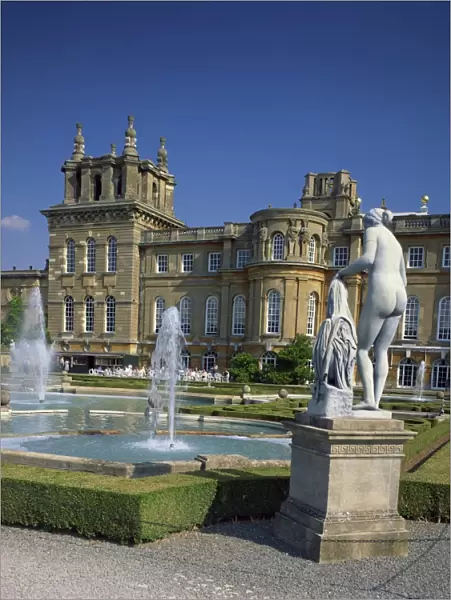 Water fountain and statue in the garden in front of Blenheim Palace, Oxfordshire