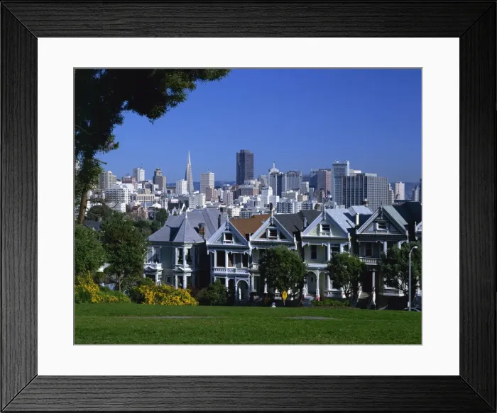 Framed Print : Old houses known as the Painted Ladies on Steiner Street, with the city skyline in the background Framed Print : Old houses known as the Painted Ladies on Steiner Street, with the city skyline in the background