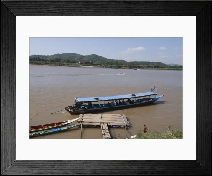 Framed Print : Boat on Mekong River, taken from Laos to Thailand on the opposite bank Framed Print : Boat on Mekong River, taken from Laos to Thailand on the opposite bank