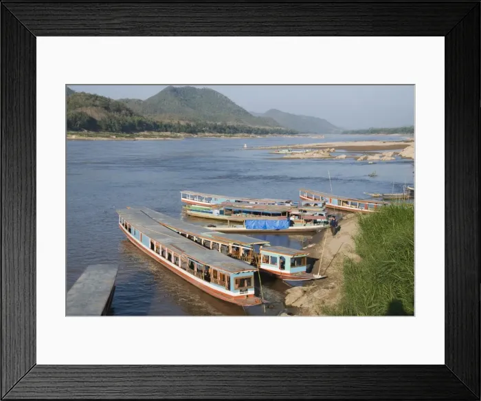 Framed Print : Tourist boats at the Pak Ou caves, Mekong River near Luang Prabang, Laos Framed Print : Tourist boats at the Pak Ou caves, Mekong River near Luang Prabang, Laos