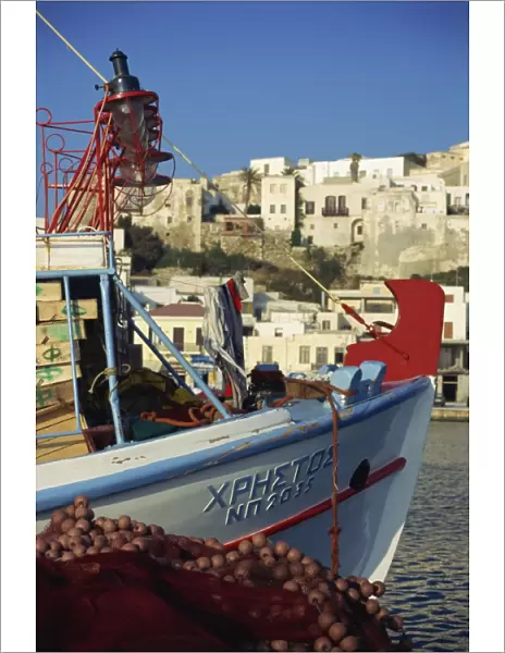Boat and village, Naxos, Cyclades, Greek Islands, Greece, Europe