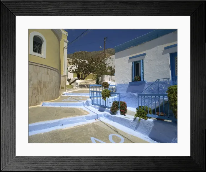 Framed Print : Steps in village street passing blue and white painted house on Kalimnos Framed Print : Steps in village street passing blue and white painted house on Kalimnos